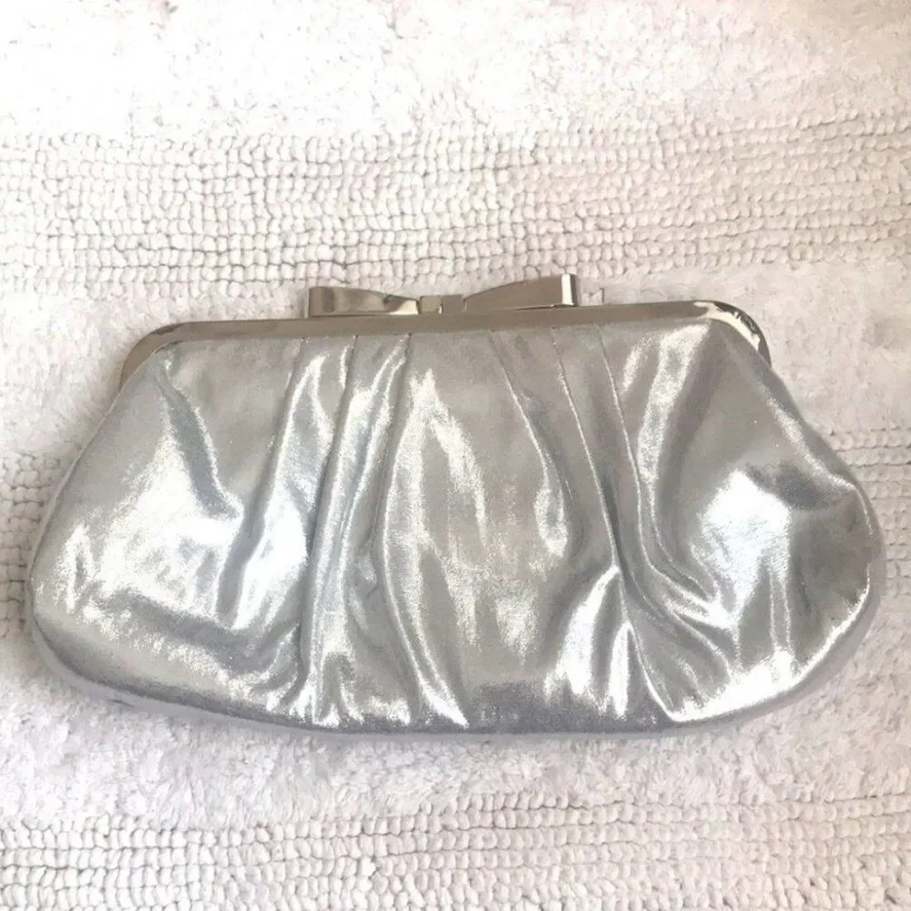 Stunning silver satin like clutch, metallic bow
